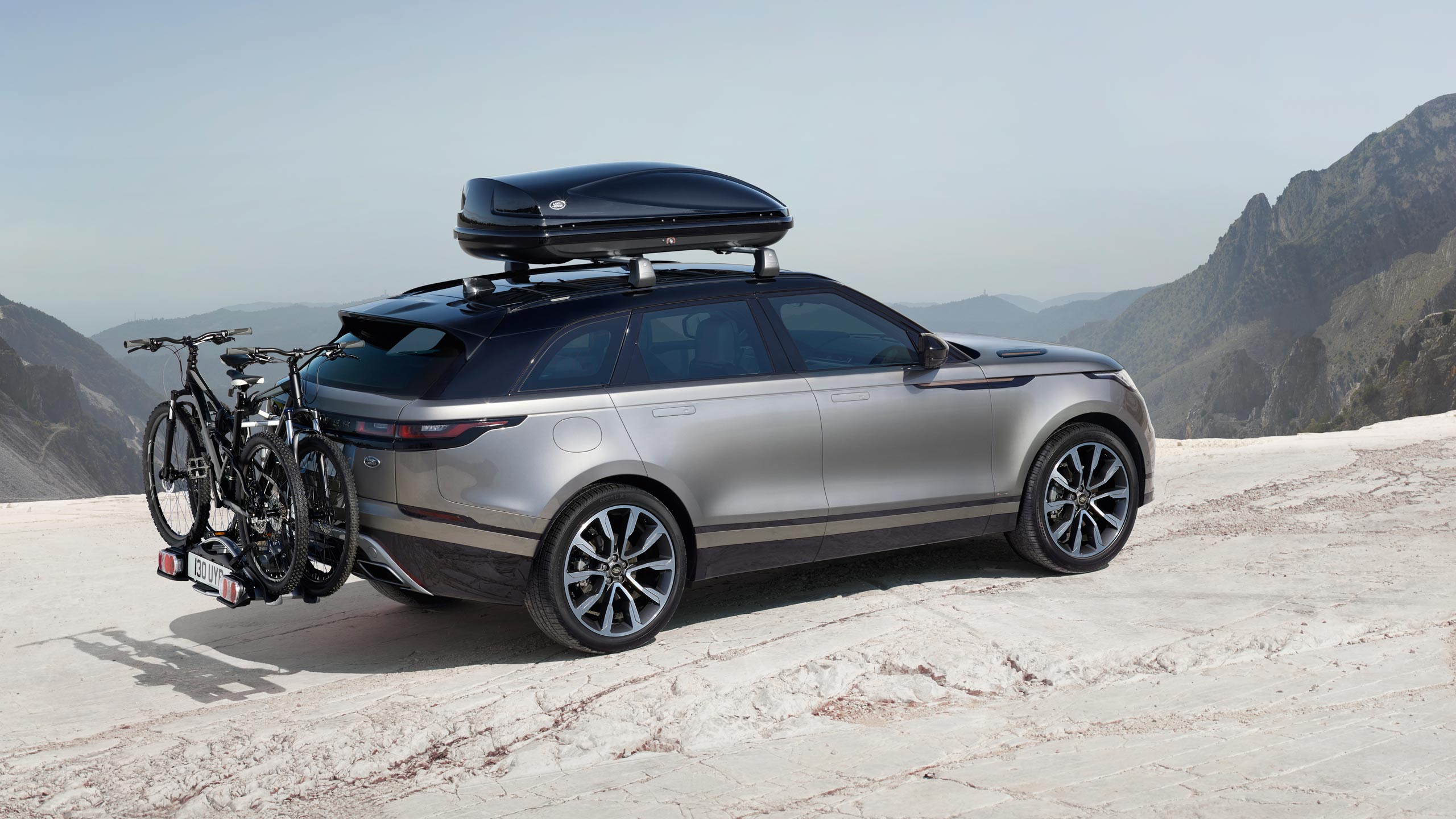 Range Rover Velar driving through mountains